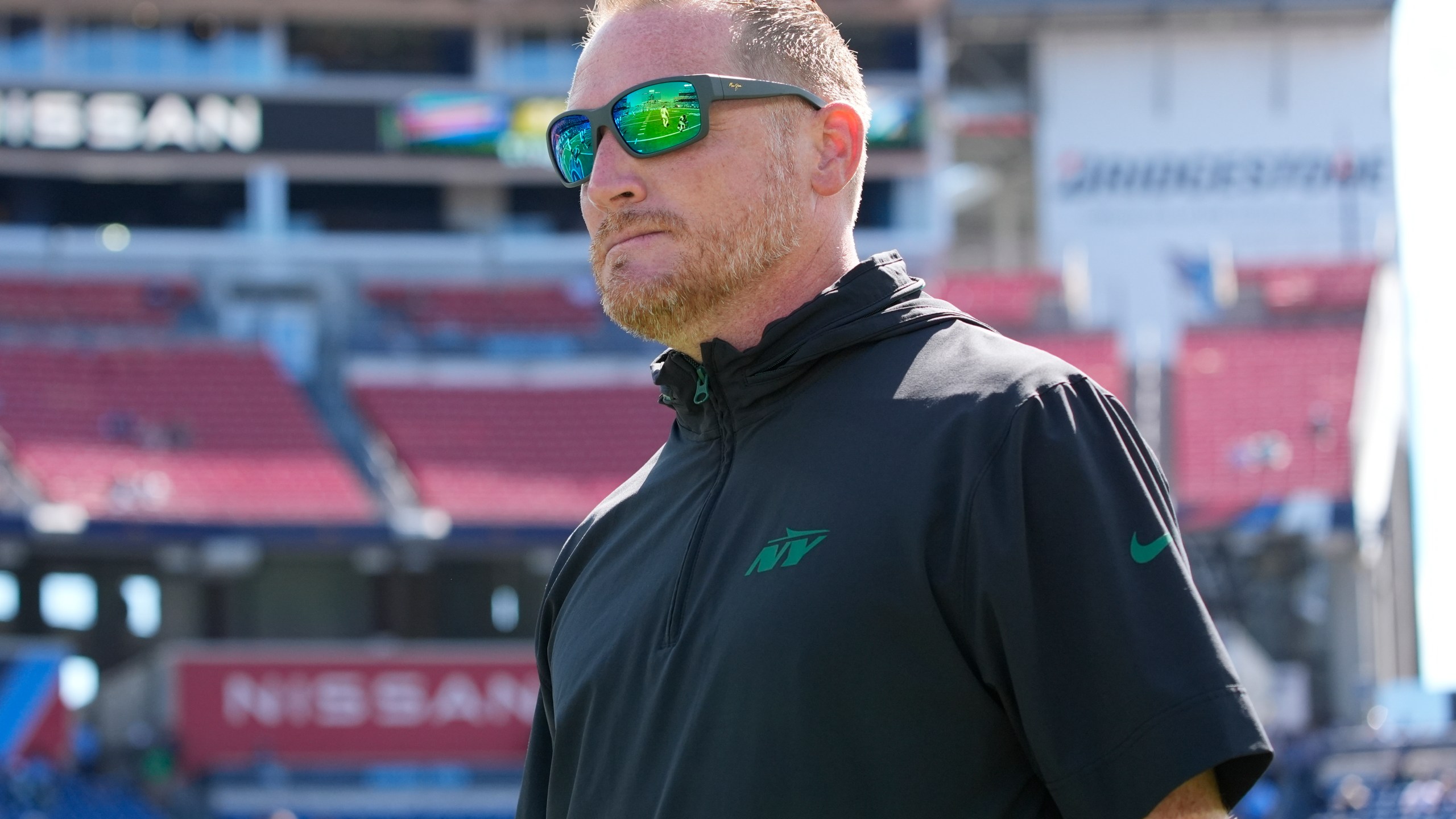 FILE - New York Jets passing game coordinator Todd Downing walks the field before an NFL football game against the Tennessee Titans, Sunday, Sept. 15, 2024, in Nashville, Tenn. (AP Photo/George Walker IV, File)