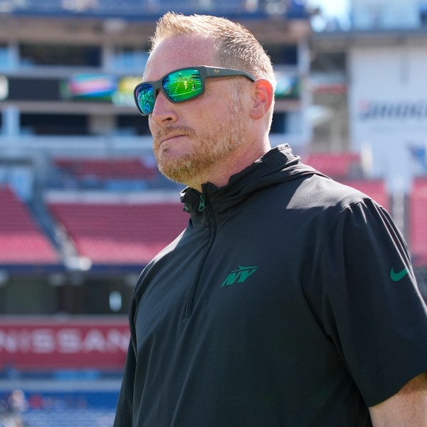 FILE - New York Jets passing game coordinator Todd Downing walks the field before an NFL football game against the Tennessee Titans, Sunday, Sept. 15, 2024, in Nashville, Tenn. (AP Photo/George Walker IV, File)