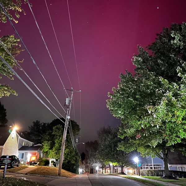 An aurora borealis, also known as the northern lights, shines over Portsmouth, N.H., Thursday, Oct. 10, 2024. (AP Photo/Caleb Jones)