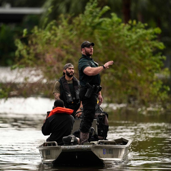 FILE - People are rescued from an apartment complex after flooding in the aftermath of Hurricane Milton, Oct. 10, 2024, in Clearwater, Fla. (AP Photo/Mike Stewart, File)