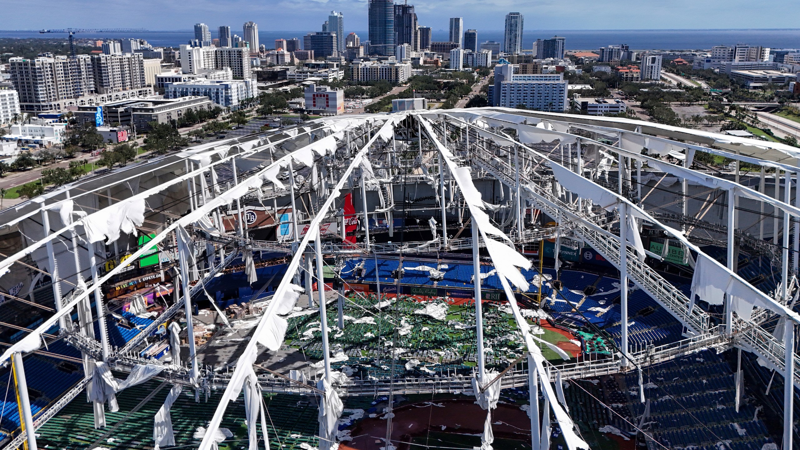 FILE - The roof of the Tropicana Field is damaged the morning after Hurricane Milton hit the region, Oct. 10, 2024, in St. Petersburg, Fla. (AP Photo/Mike Carlson, File)