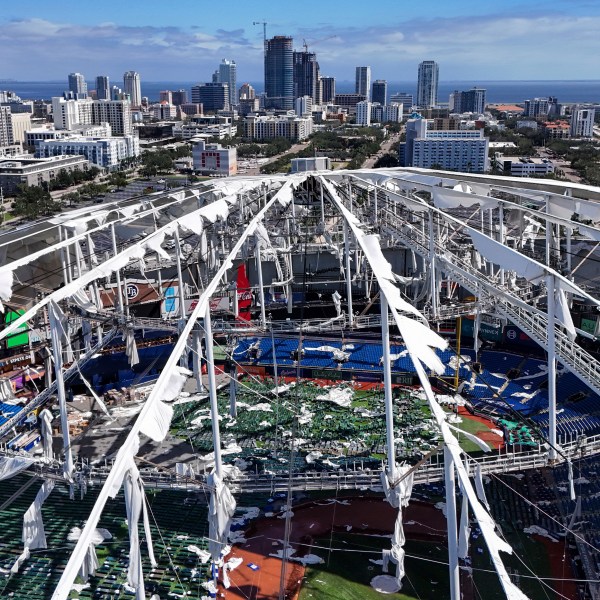 FILE - The roof of the Tropicana Field is damaged the morning after Hurricane Milton hit the region, Oct. 10, 2024, in St. Petersburg, Fla. (AP Photo/Mike Carlson, File)