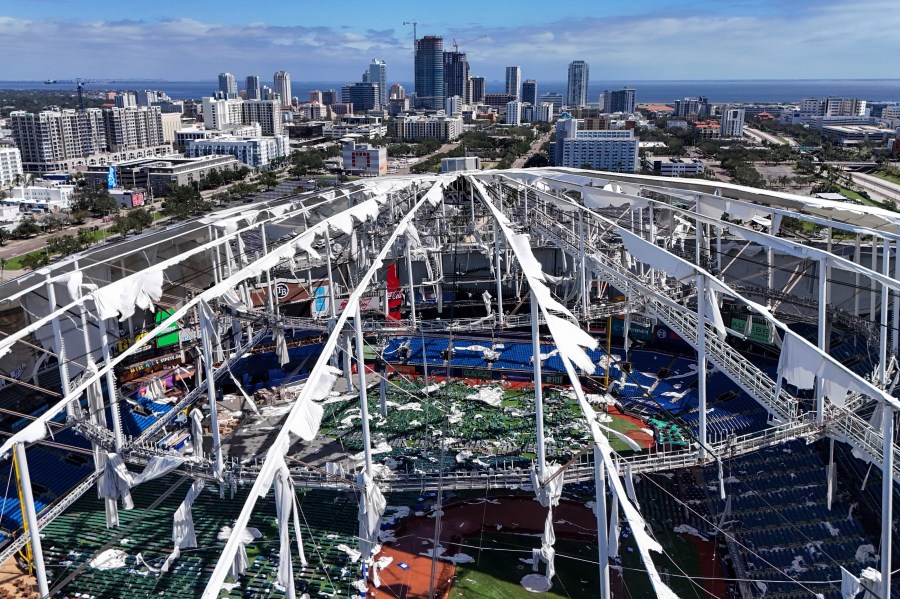 FILE - The roof of the Tropicana Field is damaged the morning after Hurricane Milton hit the region, Oct. 10, 2024, in St. Petersburg, Fla. (AP Photo/Mike Carlson, File)