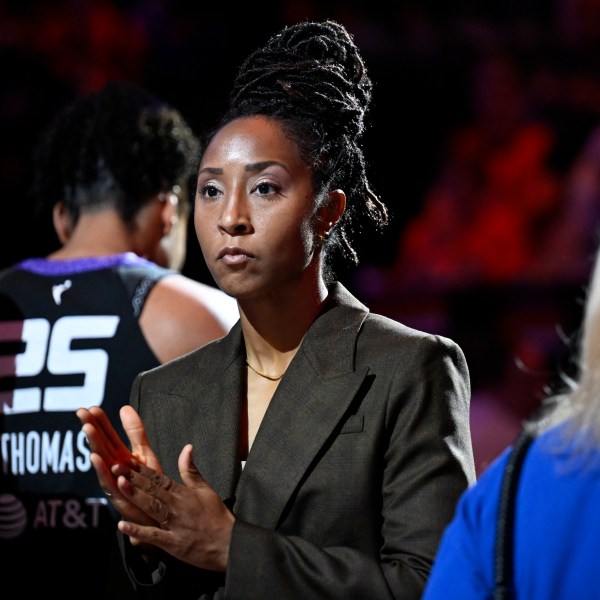 FILE - Connecticut Sun assistant coach Briann January at the start of a WNBA basketball semifinal game against the Minnesota Lynx, Oct. 4, 2024, in Uncasville, Conn. (AP Photo/Jessica Hill, File)