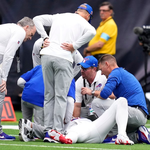 Buffalo Bills quarterback Josh Allen is looked at by trainers after getting injured during the second half of an NFL football game against the Houston Texans, Sunday, Oct. 6, 2024, in Houston. (AP Photo/Eric Christian Smith)