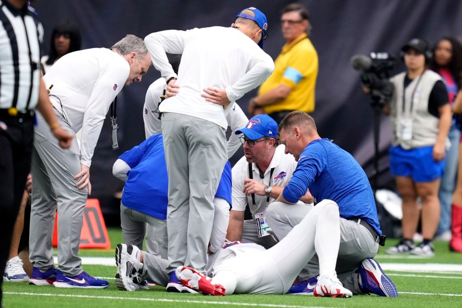 Buffalo Bills quarterback Josh Allen is looked at by trainers after getting injured during the second half of an NFL football game against the Houston Texans, Sunday, Oct. 6, 2024, in Houston. (AP Photo/Eric Christian Smith)