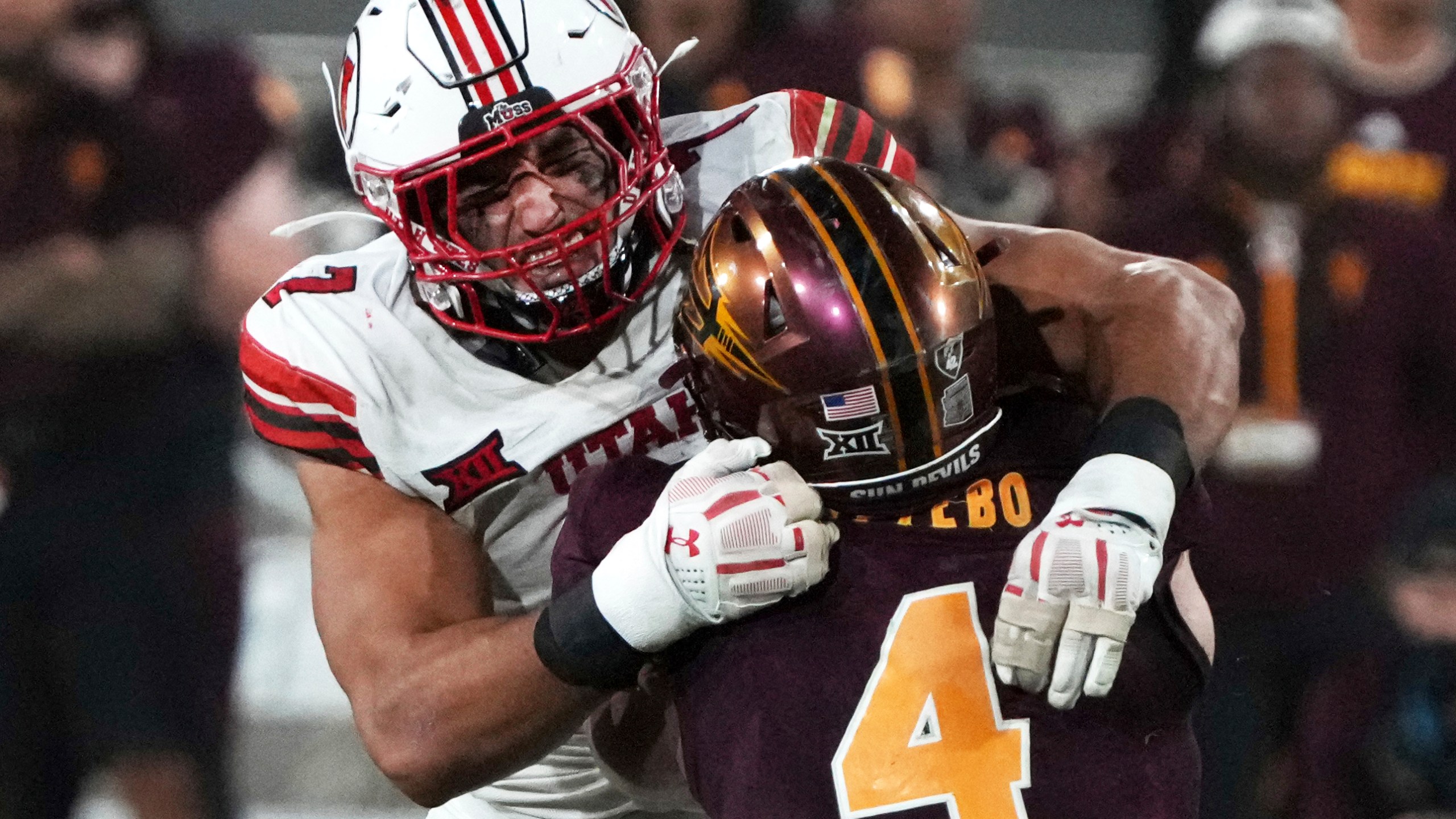 Utah defensive end Van Fillinger tackles Arizona State running back Cam Skattebo (4) in the second half during an NCAA college football game, Friday, Oct. 11, 2024, in Tempe, Ariz. Arizona State won 27-19. (AP Photo/Rick Scuteri)