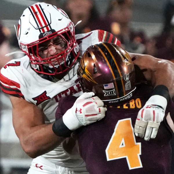 Utah defensive end Van Fillinger tackles Arizona State running back Cam Skattebo (4) in the second half during an NCAA college football game, Friday, Oct. 11, 2024, in Tempe, Ariz. Arizona State won 27-19. (AP Photo/Rick Scuteri)