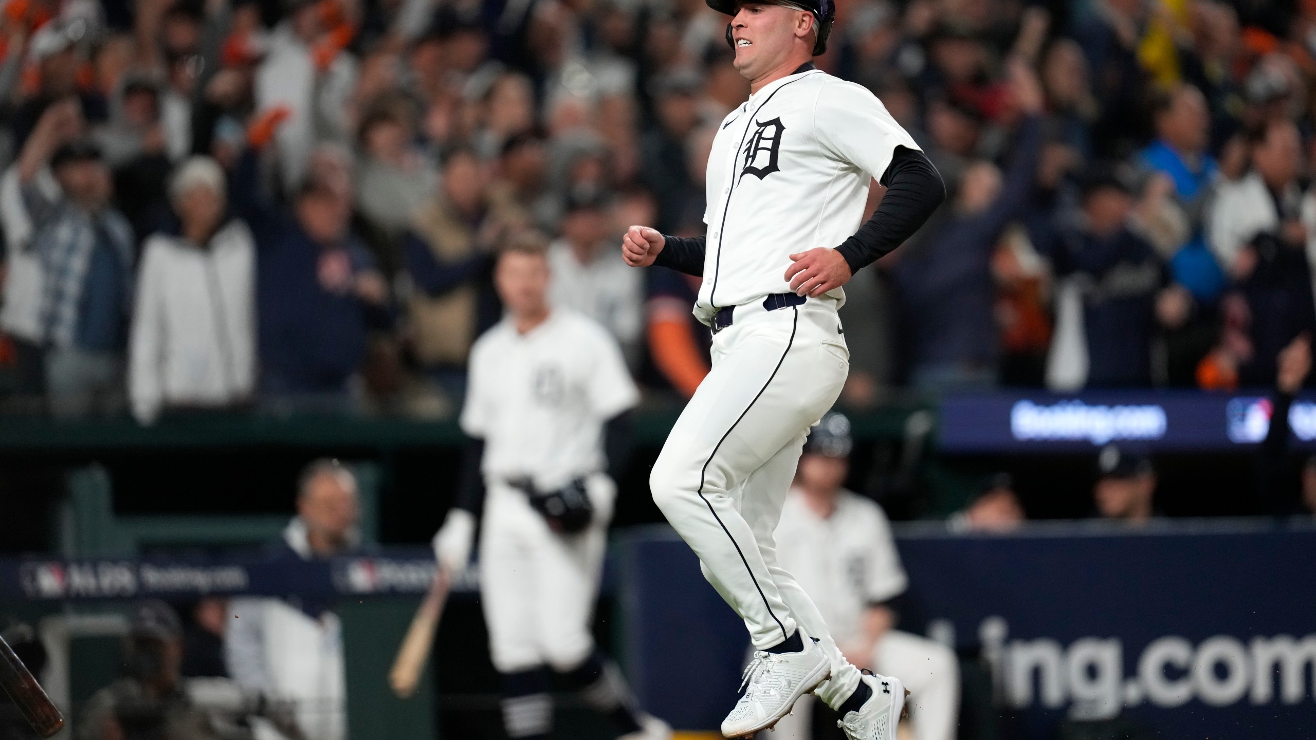 Detroit Tigers' Kerry Carpenter reacts after scoring in the sixth inning during Game 4 of a baseball American League Division Series against the Cleveland Guardians, Thursday, Oct. 10, 2024, in Detroit. (AP Photo/Paul Sancya)