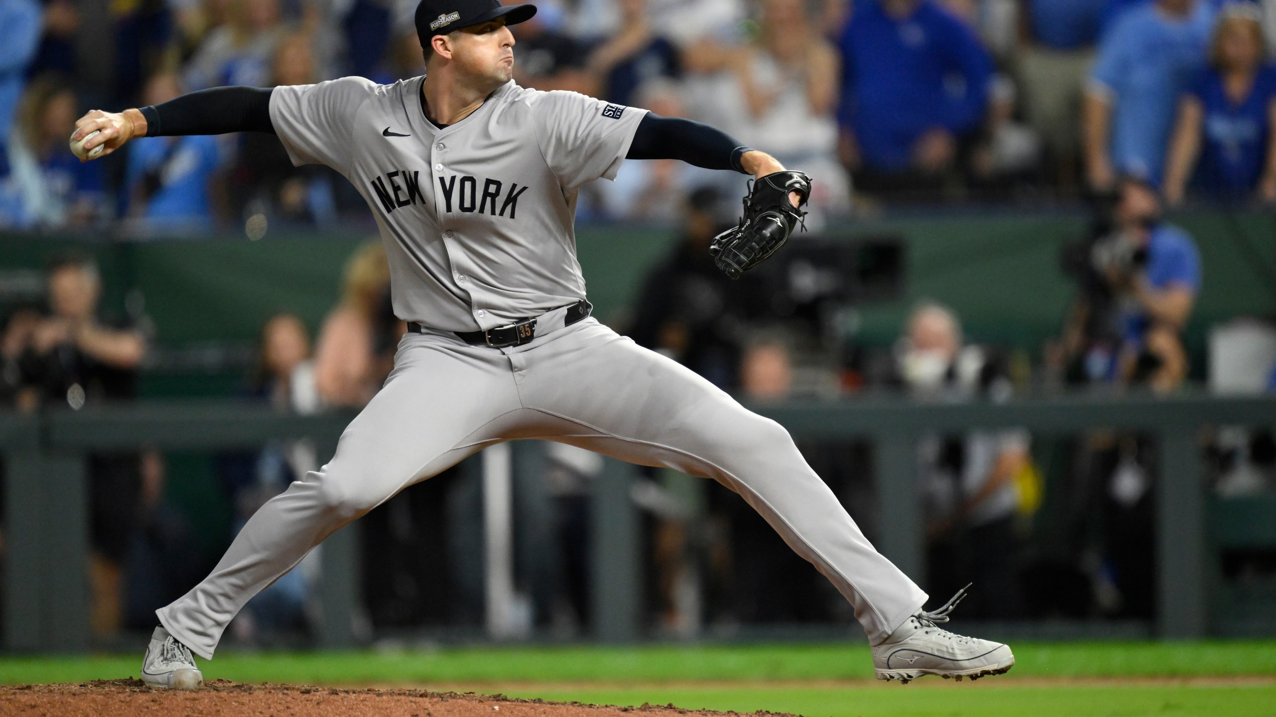 New York Yankees relief pitcher Clay Holmes throws during the eighth inning in Game 4 of an American League Division baseball playoff series against the Kansas City Royals Thursday, Oct. 10, 2024, in Kansas City, Mo. (AP Photo/Reed Hoffmann)