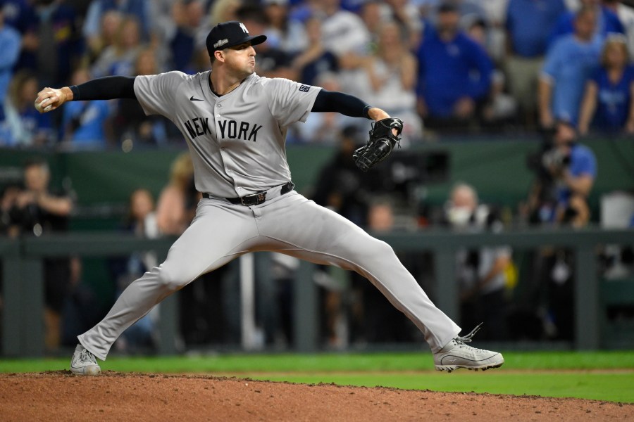 New York Yankees relief pitcher Clay Holmes throws during the eighth inning in Game 4 of an American League Division baseball playoff series against the Kansas City Royals Thursday, Oct. 10, 2024, in Kansas City, Mo. (AP Photo/Reed Hoffmann)