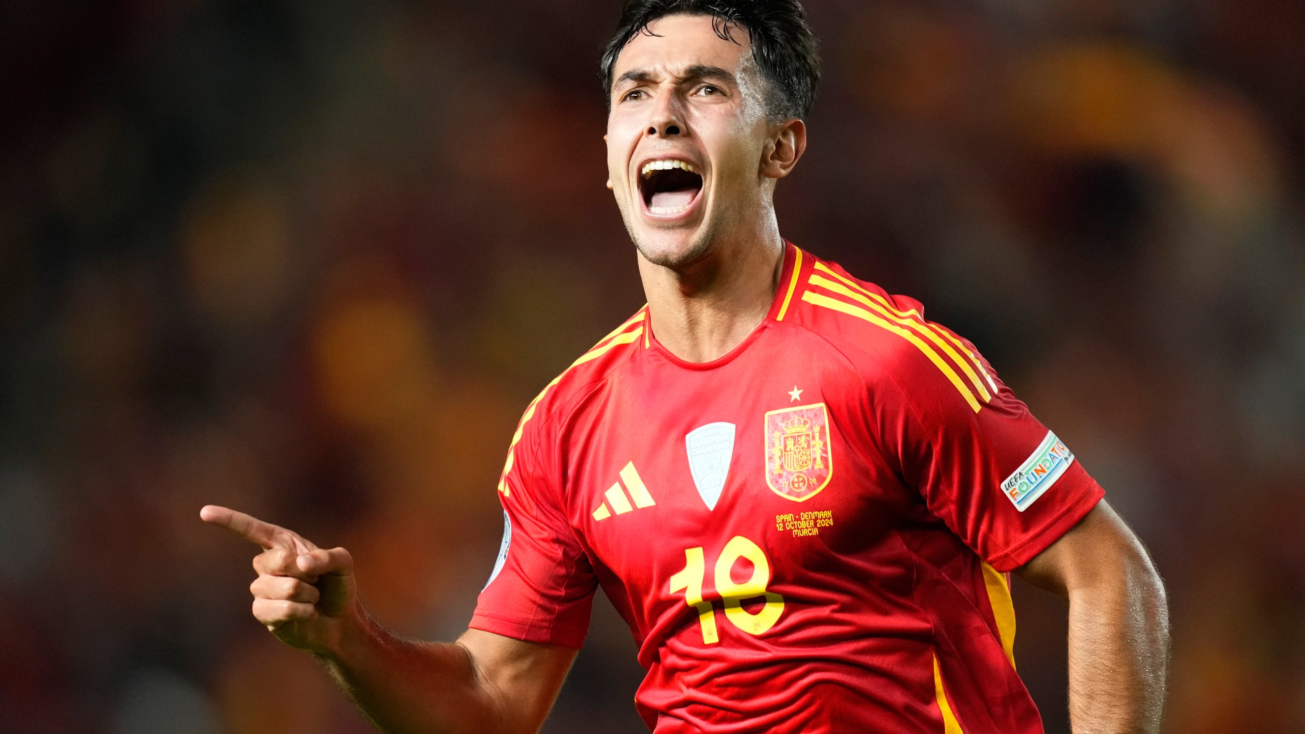 Spain's Martín Zubimendi celebrates after scoring the opening goal during the UEFA Nations League group 4 soccer match between Spain and Denmark in Murcia, Spain, Saturday, Oct. 12, 2024. (AP Photo/Jose Breton)