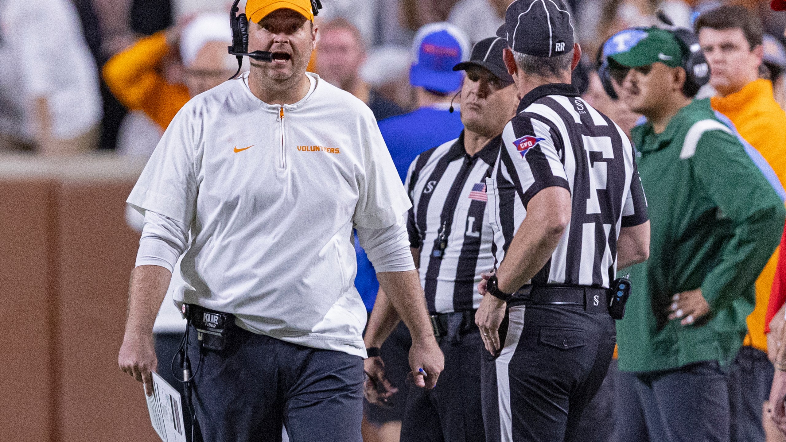 Tennessee head coach Josh Heupel, left, yells to field judge Phillip Davenport during the second half of an NCAA college football game against Florida, Saturday, Oct. 12, 2024, in Knoxville, Tenn. (AP Photo/Wade Payne)