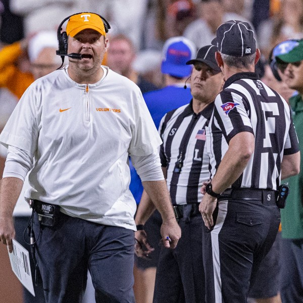 Tennessee head coach Josh Heupel, left, yells to field judge Phillip Davenport during the second half of an NCAA college football game against Florida, Saturday, Oct. 12, 2024, in Knoxville, Tenn. (AP Photo/Wade Payne)