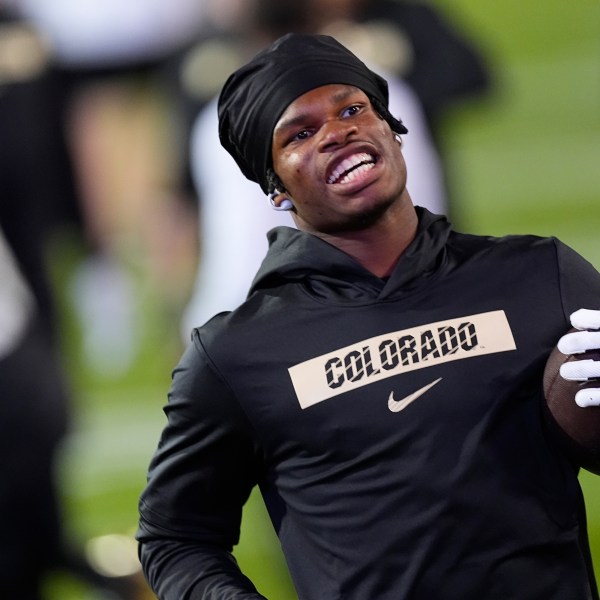 Colorado wide receiver Travis Hunter warms up before an NCAA college football game against Kansas State, Saturday, Oct. 12, 2024, in Boulder, Colo. (AP Photo/David Zalubowski)