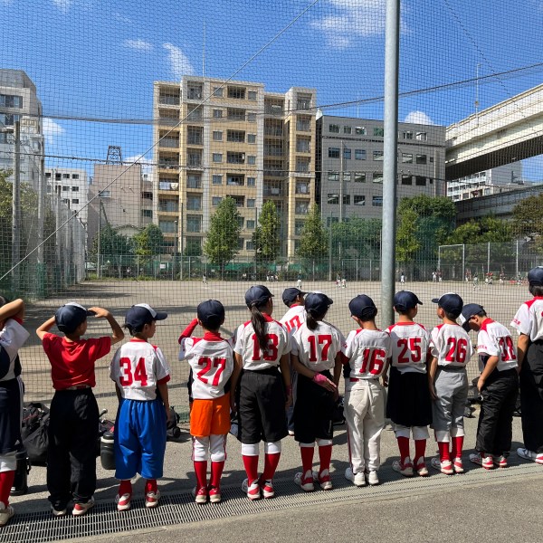 The Fukagawa Hawks youth baseball team stand in line after their practice Sunday, Oct. 13, 2024, in Tokyo, Japan. (AP Photo/Stephen Wade)