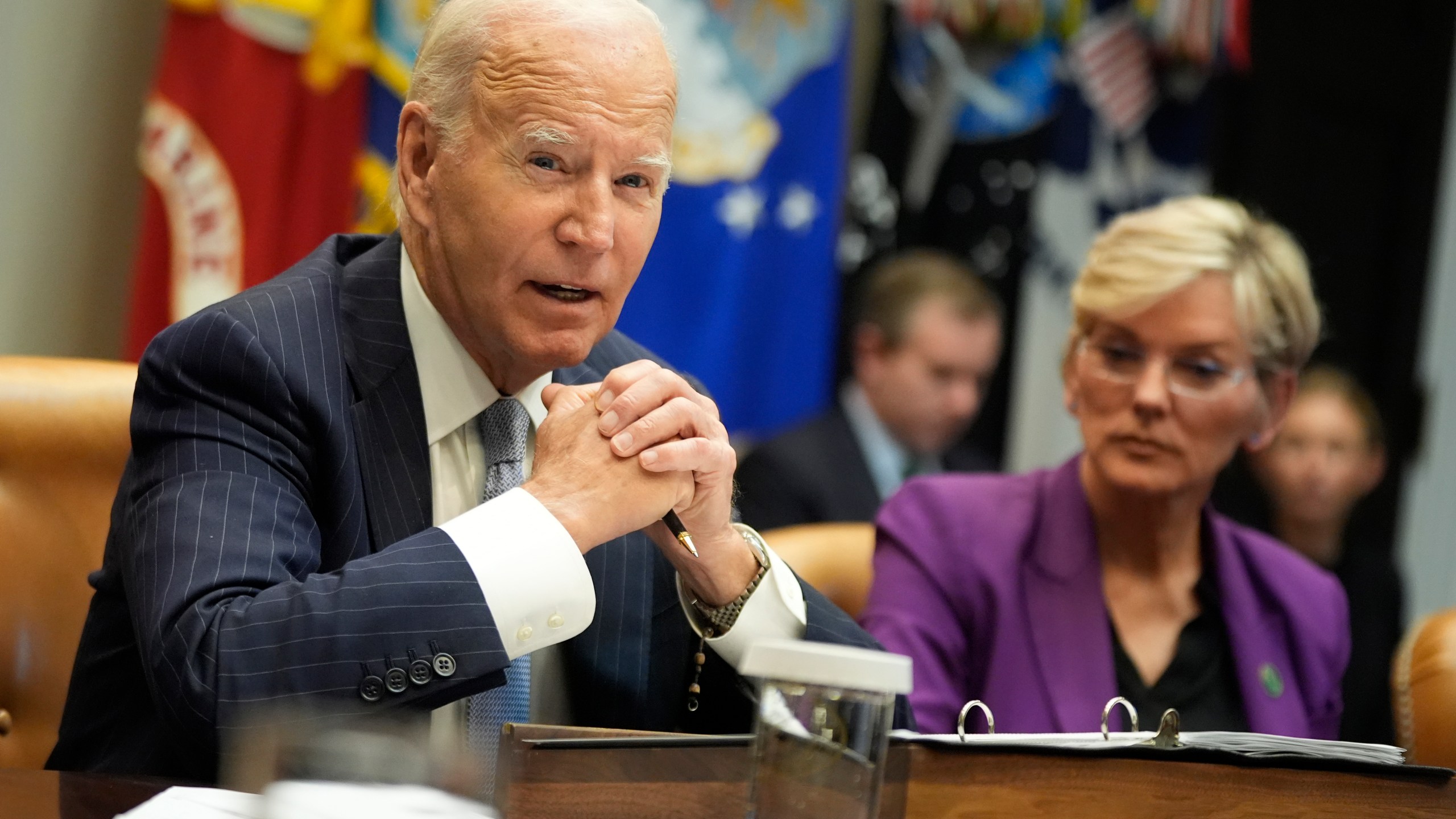 President Joe Biden speaks about the federal government's response to Hurricanes Milton and Helene as as Energy Secretary Jennifer Granholm listens, in the Roosevelt Room of the White House, Friday, Oct. 11, 2024, in Washington. (AP Photo/Manuel Balce Ceneta)