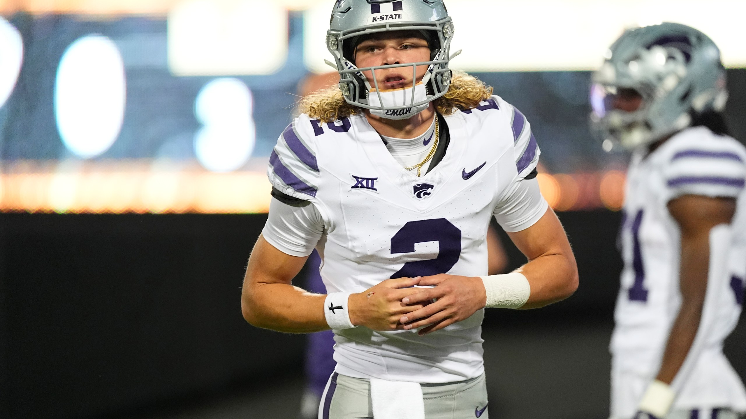 Kansas State quarterback Avery Johnson warms up before an NCAA college football game against Colorado, Saturday, Oct. 12, 2024, in Boulder, Colo. (AP Photo/David Zalubowski)