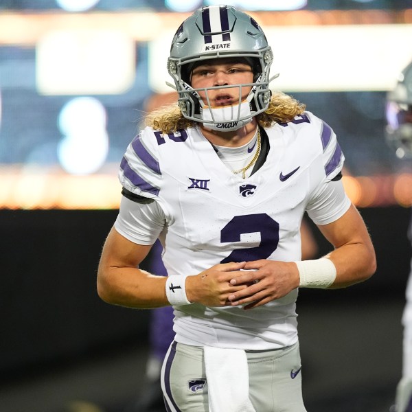 Kansas State quarterback Avery Johnson warms up before an NCAA college football game against Colorado, Saturday, Oct. 12, 2024, in Boulder, Colo. (AP Photo/David Zalubowski)