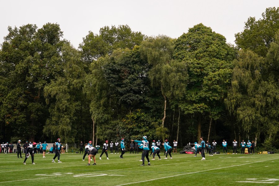 Jacksonville Jaguars players participate in a NFL football training session in Watford, near London, Saturday, Oct. 12, 2024, ahead of the game against the Chicago Bears at the Tottenham Hotspur stadium on Sunday. (AP Photo/Alberto Pezzali)