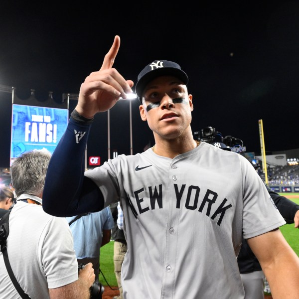 New York Yankees' Aaron Judge celebrates a 3-1 victory over the Kansas City Royals in Game 4 of an American League Division baseball playoff series Thursday, Oct. 10, 2024, in Kansas City, Mo (AP Photo/Reed Hoffmann)