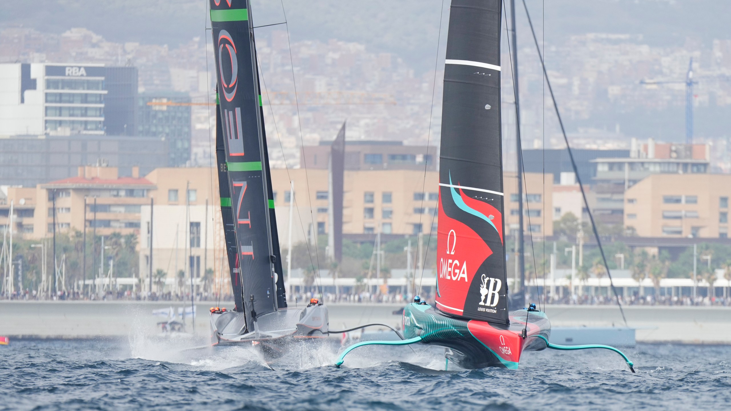 Ineos Britannia and Emirates Team New Zealand race during the Louis Vuitton 37th America's Cup Day 2 race in Barcelona, Spain, Sunday, Oct. 13, 2024. (AP Photo/Bernat Armangue)