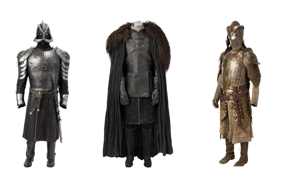 This combination of images released by Heritage Auctions shows costumes worn by characters from "Game of Thrones," from left, armor worn by Gregor "The Mountain" Clegane, Jon Snow's Night's Watch ensemble, and Jaime Lannister's full Kingsguard armor. (Heritage Auctions via AP)