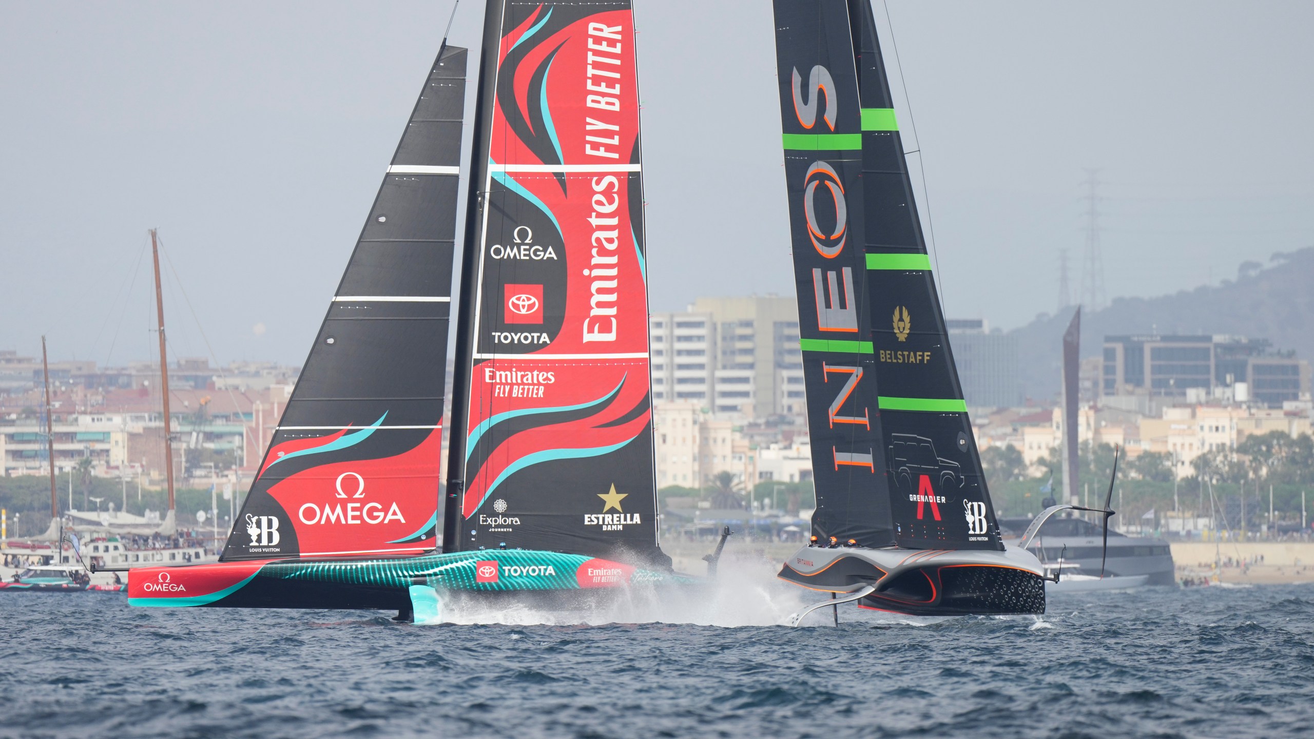 Ineos Britannia and Emirates Team New Zealand race during the Louis Vuitton 37th America's Cup Day 2 race in Barcelona, Spain, Sunday, Oct. 13, 2024. (AP Photo/Bernat Armangue)