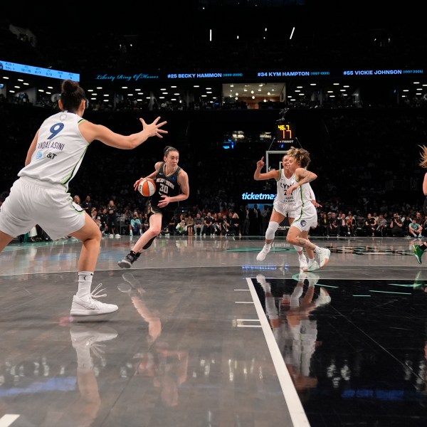 New York Liberty's Breanna Stewart (30) dribbles during the first half in Game 2 of a WNBA basketball final playoff series against the Minnesota Lynx, Sunday, Oct. 13, 2024, in New York. (AP Photo/Pamela Smith)