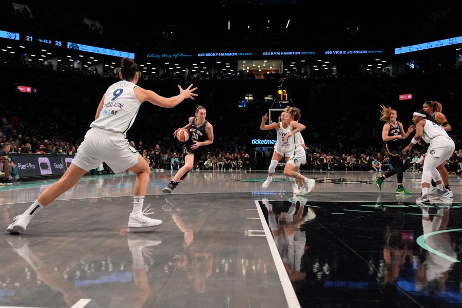 New York Liberty's Breanna Stewart (30) dribbles during the first half in Game 2 of a WNBA basketball final playoff series against the Minnesota Lynx, Sunday, Oct. 13, 2024, in New York. (AP Photo/Pamela Smith)