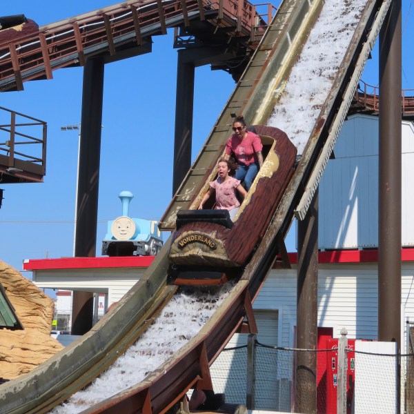 People ride the log flume at Gillian's Wonderland, the popular amusement park on the boardwalk in the Ocean City, N.J., during its final day of operation before shutting down for good, Sunday, Oct. 13, 2024. (AP Photo/Wayne Parry)