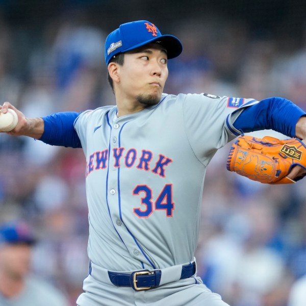 New York Mets pitcher Kodai Senga throws against the Los Angeles Dodgers during the first inning in Game 1 of a baseball NL Championship Series, Sunday, Oct. 13, 2024, in Los Angeles. (AP Photo/Ashley Landis)