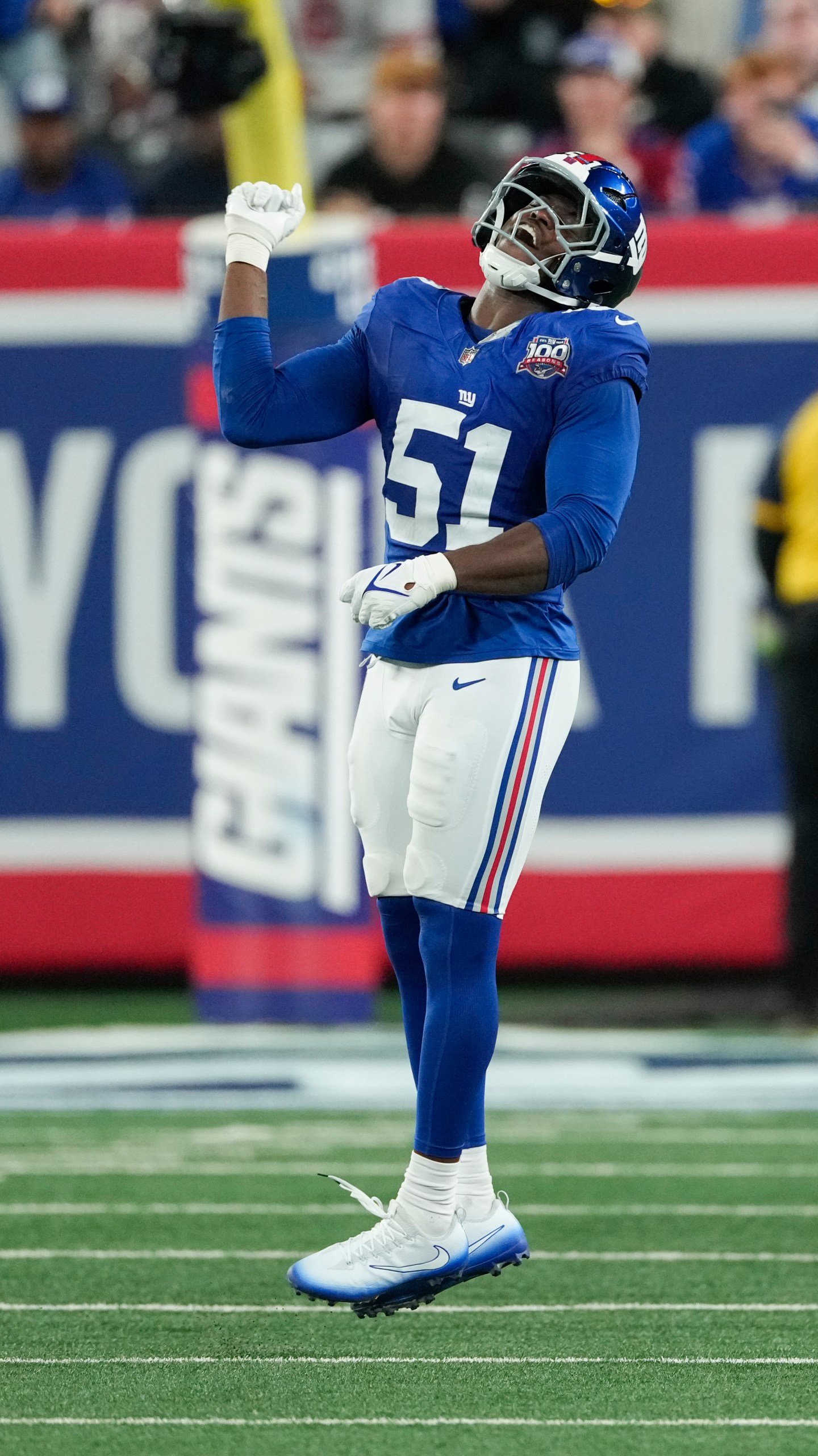 New York Giants linebacker Azeez Ojulari (51) celebrates after sacking Cincinnati Bengals quarterback Joe Burrow during the first half of an NFL football game, Sunday, Oct. 13, 2024, in East Rutherford, N.J. (AP Photo/Seth Wenig)