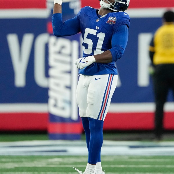 New York Giants linebacker Azeez Ojulari (51) celebrates after sacking Cincinnati Bengals quarterback Joe Burrow during the first half of an NFL football game, Sunday, Oct. 13, 2024, in East Rutherford, N.J. (AP Photo/Seth Wenig)