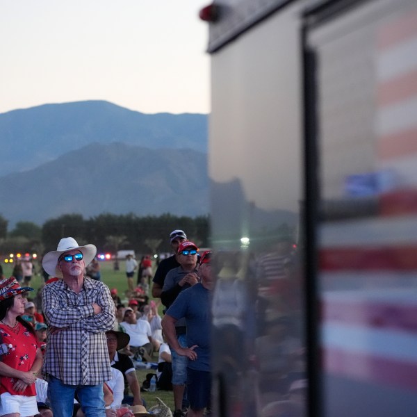 Attendees watch as Republican presidential nominee former President Donald Trump speaks at a campaign rally at the Calhoun Ranch, Saturday, Oct. 12, 2024, in Coachella, Calif. (AP Photo/Alex Brandon)