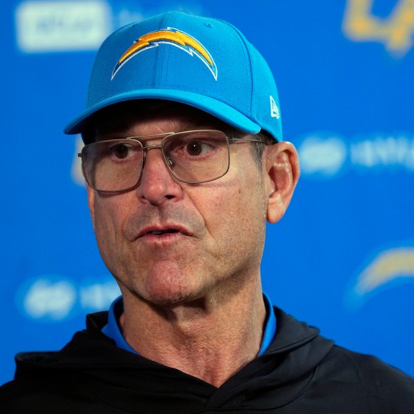 Los Angeles Chargers head coach Jim Harbaugh responds to a question during news conference after defeating the Denver Broncos in an NFL football game Sunday, Oct. 13, 2024, in Denver. (AP Photo/David Zalubowski)