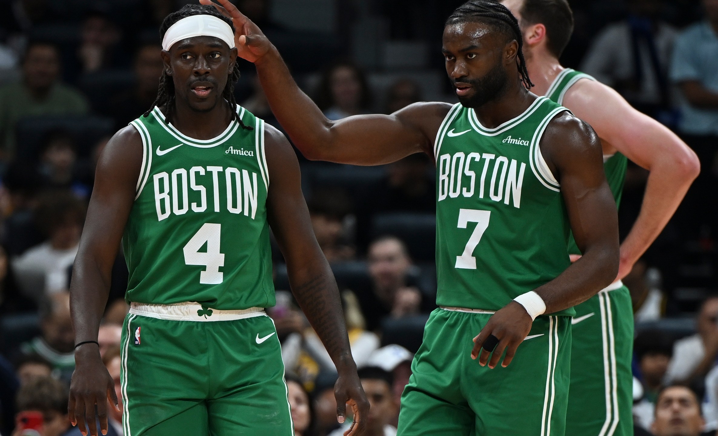 Boston Celtics Jrue Holiday, left, and Boston Celtics Jaylen Brown stand during a preseason game between Boston Celtics and Denver Nuggets in Abu Dhabi, United Arab Emirates, Friday, Oct. 4, 2024. (AP Photo/Martin Dokoupil)