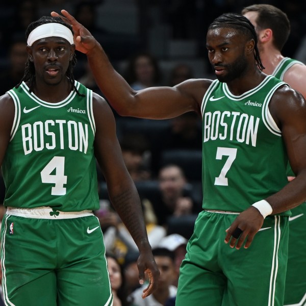 Boston Celtics Jrue Holiday, left, and Boston Celtics Jaylen Brown stand during a preseason game between Boston Celtics and Denver Nuggets in Abu Dhabi, United Arab Emirates, Friday, Oct. 4, 2024. (AP Photo/Martin Dokoupil)