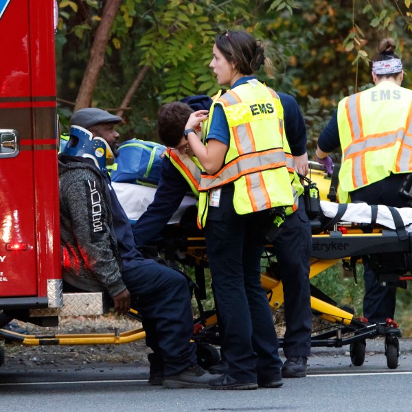 Fire and rescue personnel are on the scene of a train accident in Mansfield Twp., Burlington County, Monday, Oct. 14, 2024. (Alejandro A. Alvarez/The Philadelphia Inquirer via AP)