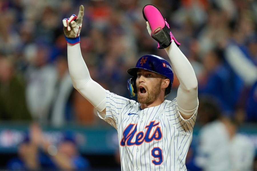 New York Mets' Brandon Nimmo (9) celebrates after scoring on a base hit by Starling Marte against the Philadelphia Phillies during the sixth inning of Game 3 of the National League baseball playoff series, Tuesday, Oct. 8, 2024, in New York. (AP Photo/Seth Wenig)