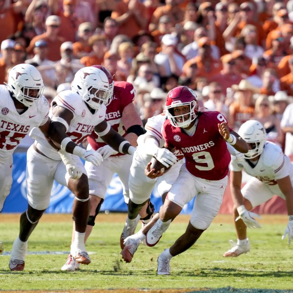 Oklahoma quarterback Michael Hawkins Jr. (9) is stripped of the ball by Texas in the second half of an NCAA college football game in Dallas, Saturday, Oct. 12, 2024. (AP Photo/Jeffrey McWhorter)