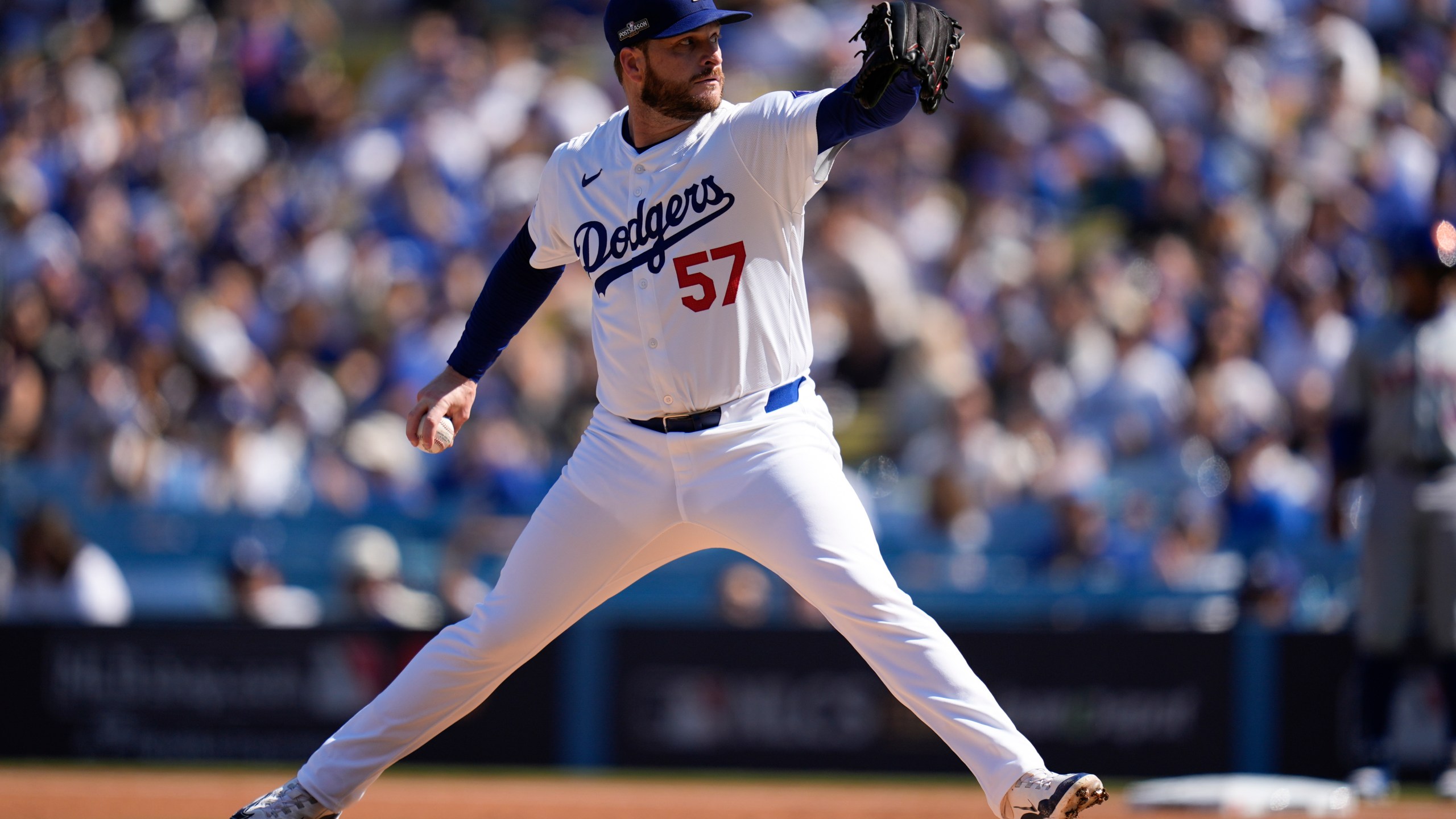 Los Angeles Dodgers pitcher Ryan Brasier throws against the New York Mets during the first inning in Game 2 of a baseball NL Championship Series, Monday, Oct. 14, 2024, in Los Angeles. (AP Photo/Gregory Bull)