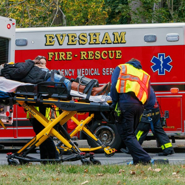 Medics attended to injured alongr Rt. 130. Train accident Mansfield Twp, NJ, New Jersey Transit Light Rail, accident, Monday, Oct. 14, 2024. (Alejandro A. Alvarez/The Philadelphia Inquirer via AP)