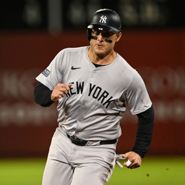 New York Yankees' Anthony Rizzo runs to third base during the fifth inning of a baseball game against the Oakland Athletics, Friday, Sept. 20, 2024, in Oakland, Calif. (AP Photo/Eakin Howard)