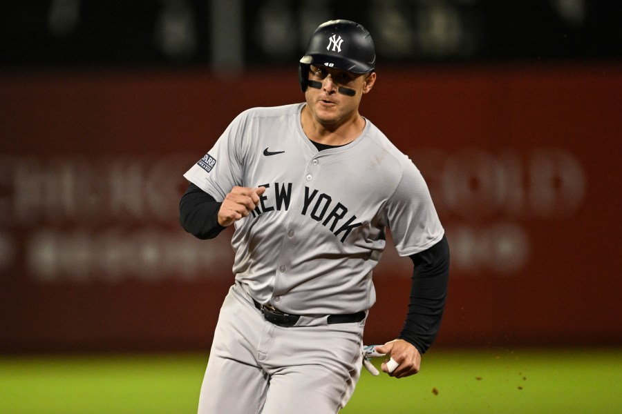 New York Yankees' Anthony Rizzo runs to third base during the fifth inning of a baseball game against the Oakland Athletics, Friday, Sept. 20, 2024, in Oakland, Calif. (AP Photo/Eakin Howard)