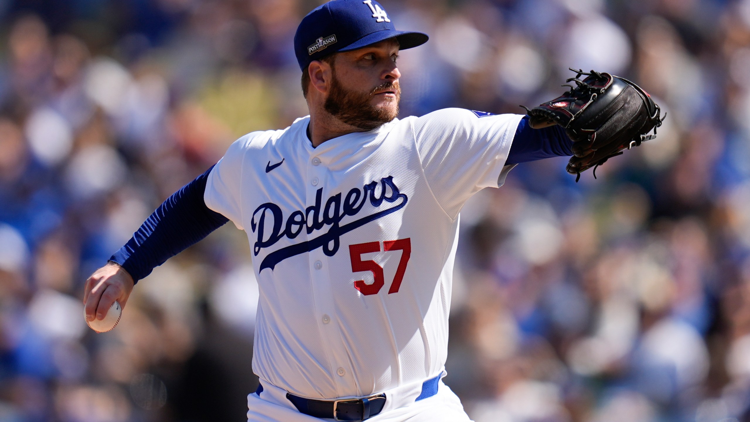 Los Angeles Dodgers pitcher Ryan Brasier throws against the New York Mets during the first inning in Game 2 of a baseball NL Championship Series, Monday, Oct. 14, 2024, in Los Angeles. (AP Photo/Gregory Bull)