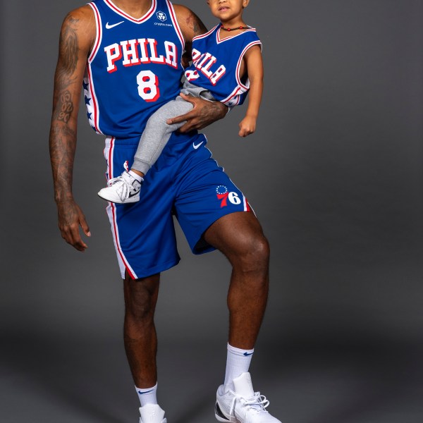 Philadelphia 76ers' Paul George poses for photos with his son, Paul, during the NBA basketball team's media day, Monday, Sept. 30, 2024, in Camden, N.J.. (AP Photo/Chris Szagola)