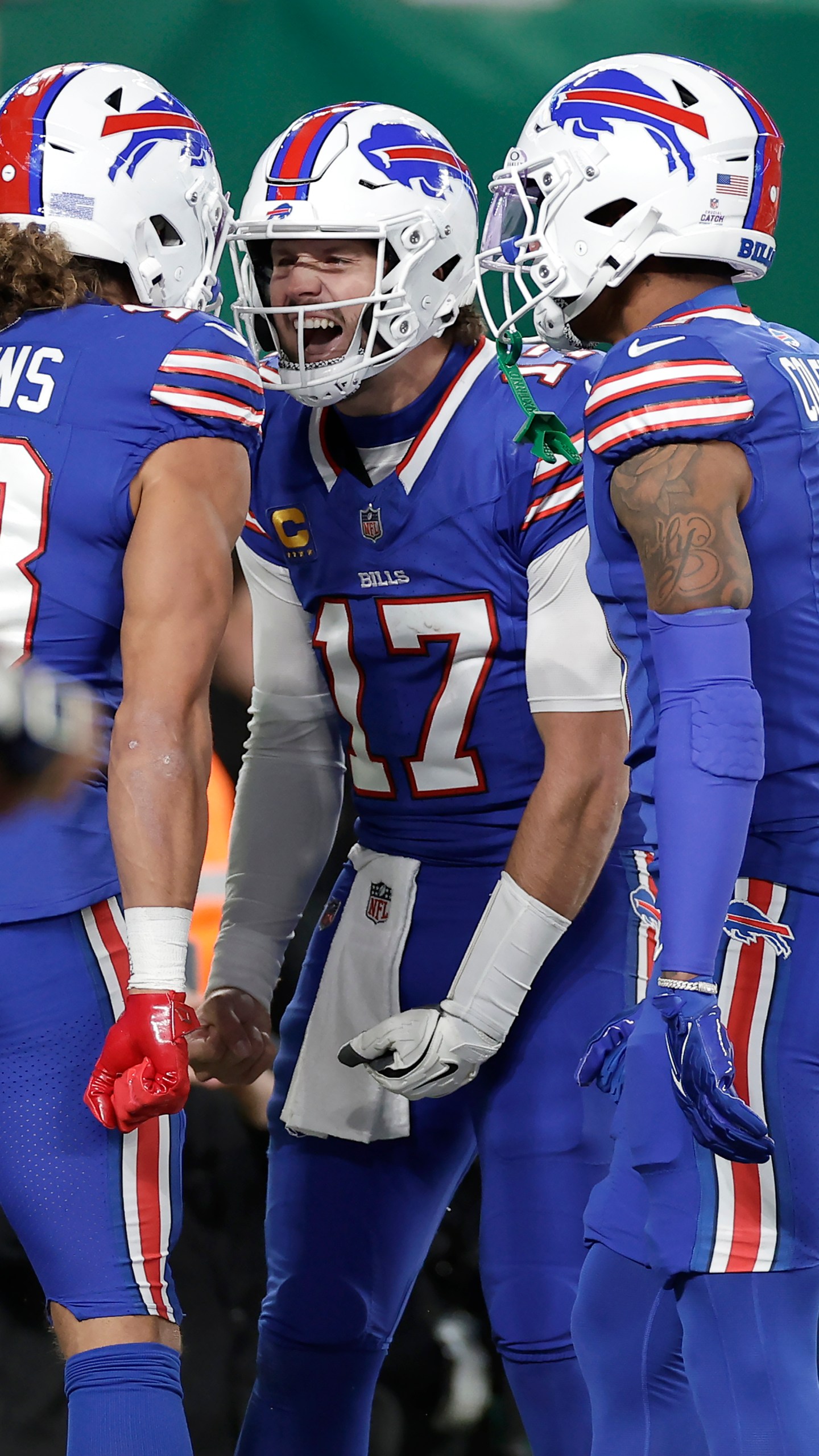 Buffalo Bills wide receiver Mack Hollins, left, celebrates with quarterback Josh Allen (17) and wide receiver Keon Coleman (0) after scoring against the New York Jets during the first half of an NFL football game in East Rutherford, N.J., Monday, Oct. 14, 2024. (AP Photo/Adam Hunger)