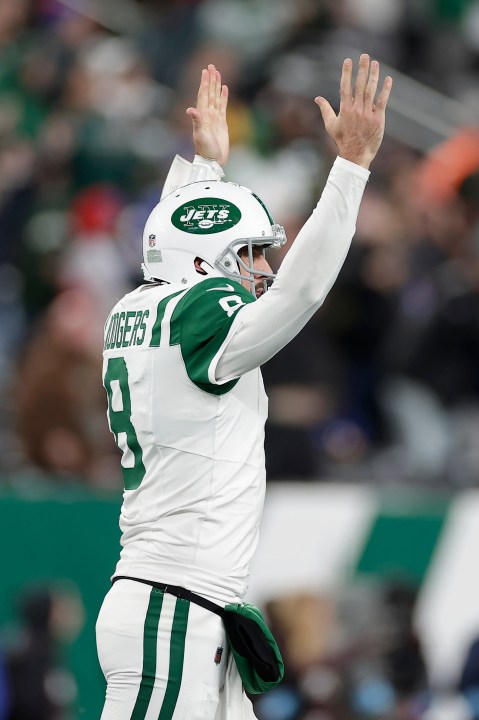 New York Jets quarterback Aaron Rodgers (8) celebrates after throwing a touchdown pass to wide receiver Allen Lazard during the first half of an NFL football game against the Buffalo Bills in East Rutherford, N.J., Monday, Oct. 14, 2024. (AP Photo/Adam Hunger)