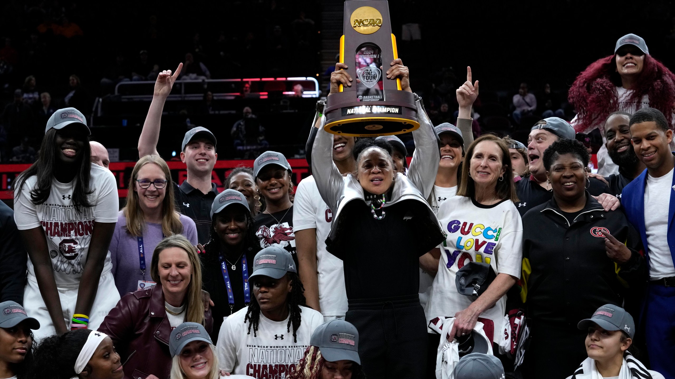 FILE - South Carolina head coach Dawn Staley celebrates with her team after the Final Four college basketball championship game against Iowa in the women's NCAA Tournament, April 7, 2024, in Cleveland. (AP Photo/Carolyn Kaster, File)